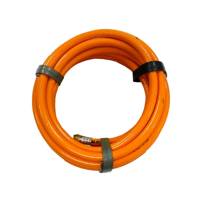 Manguera PVC naranja 1/4" para compresor de aire, enrollada con acople rápido.