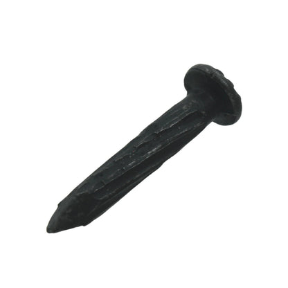 Clavo para concreto calibre 8, acabado negro rugoso, cabeza ancha y punta cónica, ideal para fijación en mampostería