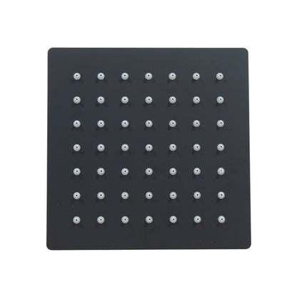 Regadera cuadrada de ducha en negro mate, acero inoxidable, con boquillas de silicona blancas y diseño moderno.