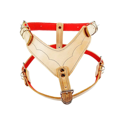 Pechera para perro de piel natural color beige y diseño en V con forro rojo, arnés ajustable y resistente.