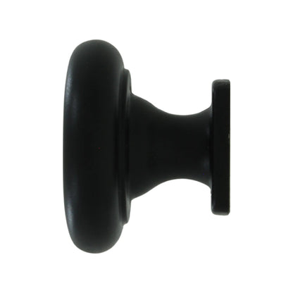 Jaladera perilla negra para mueble, diseño redondo con base, acabado mate para gabinetes y cajones.