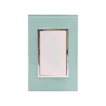 Placa de cristal azul aqua para 1 apagador de luz, con botón blanco y marco cromado, diseño moderno.
