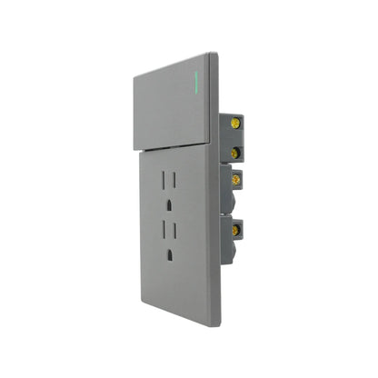 Interruptor y contacto de pared gris con luz indicadora LED y terminales laterales para instalación eléctrica.